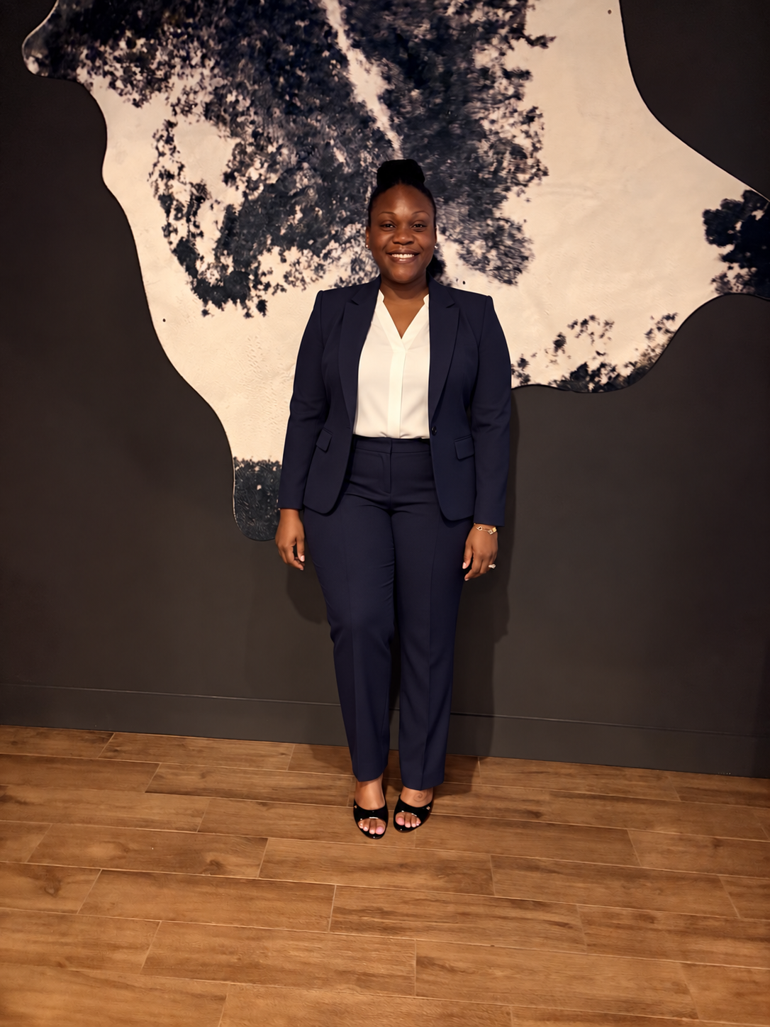 Rebecca Edme, MiNTTAX coach, wearing a navy business suit